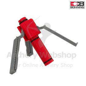 Close-up of the Bohning Spin-Fletcher on a workbench, showing its compact design and right-hand fletch setup. The plastic body and integrated clamp hold mylar vanes up to 70 mm (2.75 in) for quick, accurate refletching on carbon or aluminum shafts.